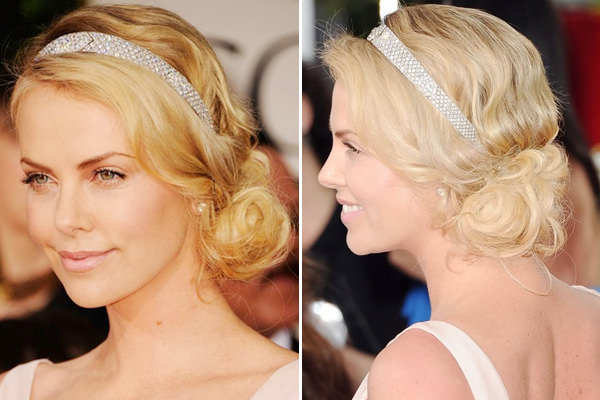 A atriz Charlize Theron com um coque lateral + tiara com brilho